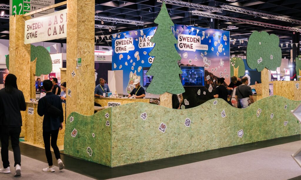 A stand at a fair that resembles a forest landscape